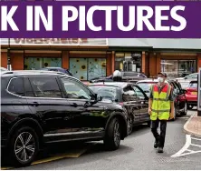  ??  ?? Queues build at the drive-thru for the McDonald’s in Pollokshaw­s as branches reopen across the country