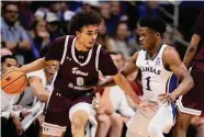  ?? Charlie Riedel/Associated Press ?? Texas Southern’s Isaiah Martin (0) drives past Kansas guard Joseph Yesufu during Monday’s game.