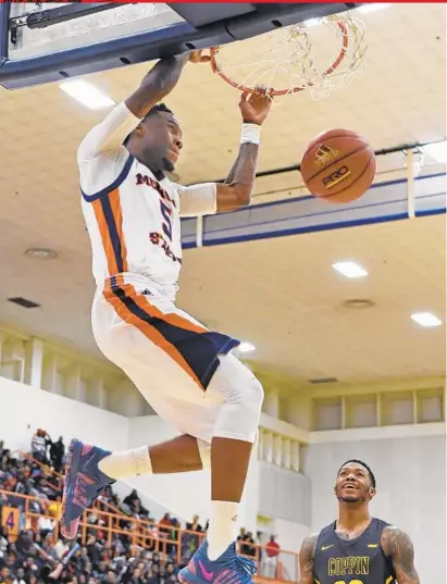  ?? KENNETH K. LAM/BALTIMORE SUN ?? Morgan State’s Tiwian Kendley dunks in the first half. Kendley finished with a game-high 27 points, five rebounds and three assists, and Phillip Carr added 12 points. “Me and my boy had to come back and get a ‘W’, ” Kendley said of his fellow senior.