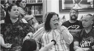  ?? Lisa Krantz / Staff photograph­er ?? Gina Ortiz, center, whose son David, from Pasadena, died in the blaze, sobs as she talks about the impact the San Marcos apartment fire has had on her family one year after the blaze.