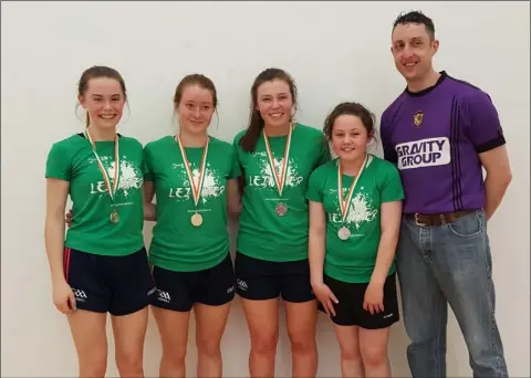  ??  ?? The Wexford quartet on the successful Leinster girls’ team with coach Gavin Buggy.