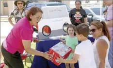  ?? WILLIAM ROLLER PHOTO ?? FROM LEFT: Luz Quiroga, patient services director for Emilio Nares Foundation, Jonathan Dalle and his mother, Catalina Penland at Ronald McDonald House Charities’ Families Supporting Families picnic at Eager Park in Imperial on Saturday.