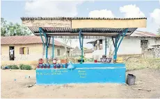  ?? ?? Vayenglay town in Nimba County, Liberia, shows a petrol station.