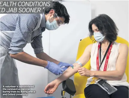  ??  ?? A volunteer is administer­ed the coronaviru­s vaccine during trials by Astrazenec­a and Oxford University