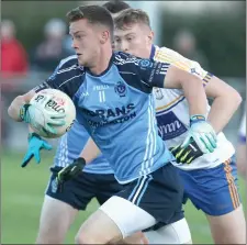  ??  ?? Danny McMahon charges forward and away from Ratoath’s Brian Power.