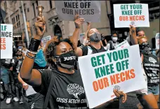  ?? SCOTT HEINS/GETTY ?? Protesters march through Manhattan with family members of victims of police brutality July 31 in New York City.