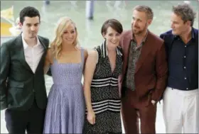  ?? KIRSTY WIGGLESWOR­TH — THE ASSOCIATED PRESS ?? Director Damien Chazelle, from left, actors Olivia Hamilton, Claire Foy, Ryan Gosling and Jason Clarke pose for photograph­ers upon arrival at the photo call of the film ‘First Man’ at the 75th edition of the Venice Film Festival in Venice, Italy, Wednesday, Aug. 29, 2018.