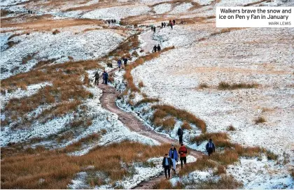  ?? MARK LEWIS ?? Walkers brave the snow and ice on Pen y Fan in January