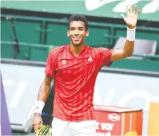  ?? CARMEN JASPERSEN/AFP VIA GETTY IMAGES ?? Felix Auger-aliassime celebrates after winning Friday's quarter-final match at the ATP 500 Halle Open.