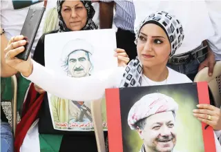  ??  ?? A Lebanese Kurd takes a selfie with a portrait of Massoud Barzani, Kurdish regional president, during a recent demonstrat­ion in Beirut in support of the referendum vote on Kurdish independen­ce planned for Sept. 25 in the Kurdish region of Iraq. (AFP)