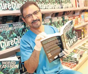  ?? Picture: JACKIE CLAUSEN ?? DEBUT NOVEL: Dr Morad Zaffron and copies of ‘The Cure’