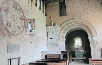  ?? PHOTOS: JERRY HARMER/ THE ASSOCIATED PRESS ?? The interior of St. Mary’s Church in Kempley boasts medieval wall paintings from the 12th century. On the left is the Wheel of Life, from the 14th or 15th century.