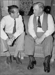  ?? (File Photo/AP) ?? Actor Gary Cooper (left) who played the title role in the movie “Sergeant York,” talks in July 1941 with Sgt. Alvin York, on whose life the movie was based, at a New York hotel.