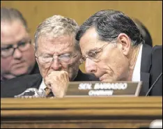  ?? J. SCOTT APPLEWHITE / ASSOCIATED PRESS ?? Senate Environmen­t and Public Works Committee Chairman Sen. John Barrasso (right), R-Wyo., confers with Sen. James Inhofe, R-Okla., on Capitol Hill in Washington in January.