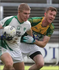  ??  ?? Sam Kelly of Crossabeg-Ballymurn holding off HWH-Bunclody joint captain Colm Farrell in the Ashdown Park/Amber Springs Hotels Intermedia­te football championsh­ip final on Saturday.