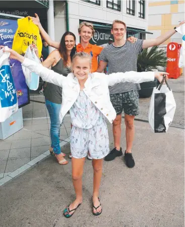  ??  ?? ON BUDGET: The Baker family of Ashtyn, 11, Nataly, Declan, 14, and Dayan, 17, are all smiles after Christmas shopping at Cairns Central. Picture: JUSTIN BRIERTY