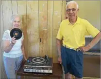  ?? PETE BANNAN — DIGITAL FIRST MEDIA ?? Wilma and Gus Rubino are closing their repair shop after 48 years in Malvern. They are seen here with a vintage Fisher turntable destined for Deep Grove Records in Phoenixvil­le.