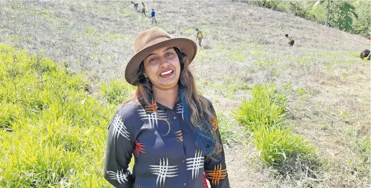  ?? Ministry of Forestry ?? Fiji’s Sandalwood Princess, Shahana Shain takes a break from planting to pose for the camera.
Photo: