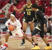  ?? (NWA Democrat-Gazette/David Gottschalk) ?? Arkansas guard Makayla Daniels (middle) secures a rebound Monday in front of two UAPB defenders during the No. 11 Razorbacks’ 86-52 victory over the Golden Lions at Walton Arena in Fayettevil­le.