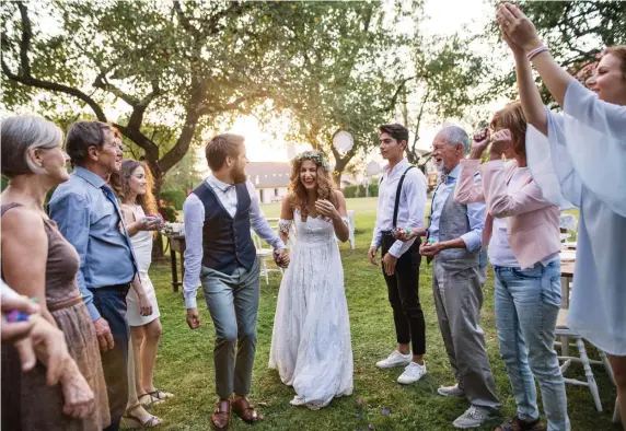  ?? GETTY IMAGES ?? MORE THAN A COUPLE: Before tying the knot, it’s good to know the family you’re marrying into — and whether they’re a good fit.