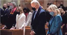  ?? EVAN VUCCI/AP ?? On Inaugurati­on Day, President-elect Joe Biden and first lady Jill Biden attend Mass at the Cathedral of St. Matthew the Apostle in Washington.
