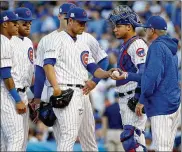  ?? JONATHAN DANIEL / GETTY IMAGES ?? Cubs manager Joe Maddon (right) continues to get heat for decisions he made in last year’s World Series, which the Cubs won.