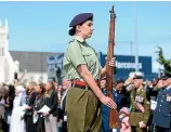  ??  ?? Alex Morgan stands to attention at the Armistice Day Remembranc­e service at the Invercargi­ll Cenotaph yesterday.