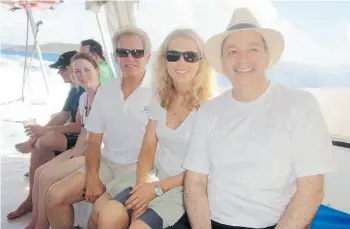  ?? SUPPLIED ?? Former Eagles lead guitarist Don Felder and Canadian wife Kathrin Nicholson (both wearing sunglasses) relax in the British Virgin Islands with Edmonton charity auctioneer Sine Chadi.