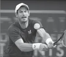  ?? AP ?? Andy Murray of Britain hits a return during his first-round win over Denis Shapovalov of Canada at the Dubai Duty Free Tennis Championsh­ips in the United Arab Emirates on Monday.