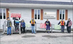  ?? ANGELA FOWLER VIA CP ?? People protest in front of MHA Lisa Dempster’s office in Forteau in this undated handout photo. L’anse-au-loup Mayor Hedley Ryland has supported a series of roadside protests, which on Monday included blockades of the local highway maintenanc­e depot...