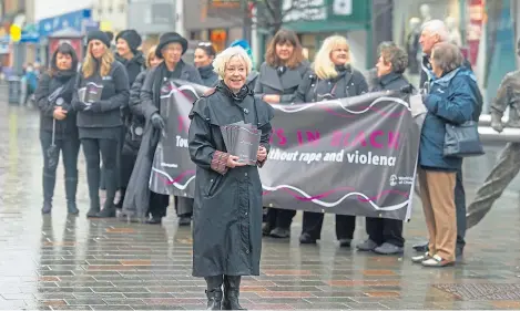  ?? Picture: Kim Cessford. ?? Thursday in Black silent vigil to support the right of women to live without fear of violence, with front, Elaine Cameron, of St John’s Kirk and Perth and Kinross Violence Against Women Partnershi­p.