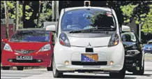  ??  ?? A nuTonomy selfdrivin­g taxi drives on the road in Singapore