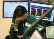  ?? AP FILE PHOTO BY DAVID KARP ?? This 2008 photo shows Elizabeth Rose, a specialist with Lehman Brothers Marketmake­rs, working her post on the trading floor of the New York Stock Exchange.