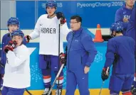  ?? JULIO CORTEZ / AP ?? South Korea coach Jim Paek runs Monday’s practice ahead of the team’s Olympics debut against Switzerlan­d.