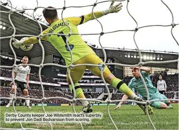  ?? ?? Derby County keeper Joe Wildsmith reacts superbly to prevent Jon Dadi Bodvarsson from scoring.