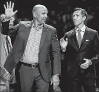  ?? AP PHOTO ?? Former NBA players Jason Kidd, left, and Steve Nash wave to the crowd as the Naismith Memorial Basketball Hall of Fame Class of 2018 members are introduced during halftime of a semifinal game between Loyola-Chicago and Michigan at the Final Four NCAA...