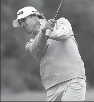  ?? The Associated Press ?? GREEN APPROACH: Aaron Baddeley hits onto the ninth green during the third round of the Valero Texas Open golf tournament Saturday at TPC San Antonio Oaks Course. Kevin Chappell shot a 1-under 71 to lead the tournament by one stroke after three rounds...