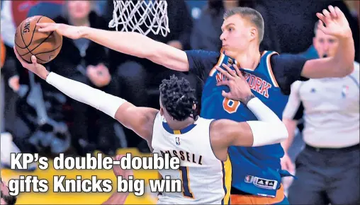  ?? Getty Images ?? LEAD BLOCKER: Kristaps Porzingis, blocking a shot by D’Angelo Russell in the Knicks’ 118-112 win over the Lakers on Sunday, finished the game with 26 points, 12 rebounds and seven blocks, leading the team in all three categories.