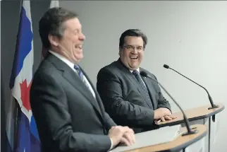  ?? P E T E R J. T H O MP S O N / NAT I O NA L P O S T ?? Toronto Mayor John Tory and Mayor Denis Coderre, sharing a laugh on Wednesday, see the federal election as an opportunit­y to securing more money for urban centres.