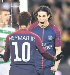  ??  ?? Paris Saint-Germain’s Edinson Cavani celebrates with Neymar after scoring against Celtic during their Group B match at the Parc des Princes Stadium in Paris. — AFP photo