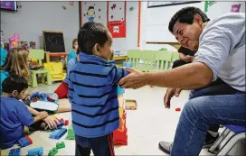  ?? SPENCER PLATT / GETTY IMAGES ?? Recently arrived migrant families rest at a Catholic Charities center Thursday in McAllen, Texas. After release from U.S. custody, families are brought to the site to rest, clean up, enjoy a meal and get guidance to their next destinatio­n.