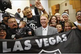  ?? AP ?? Raiders owner Mark Davis (center) with fans in 2016: “My father used to say the greatness of the Raiders is in the future. This gives us the ability to achieve that.”
