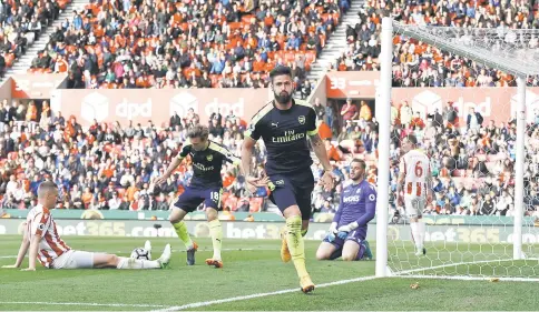  ??  ?? Arsenal’s Olivier Giroud celebrates scoring their fourth goal during the English Premier League match between Stoke City and Arsenal at bet365 Stadium in Stoke City. — Reuters photo