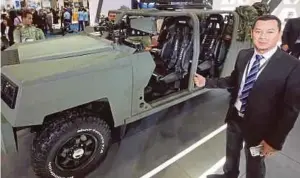  ?? PIC BY MOHD YUSNI ARIFFIN ?? Cendana Auto chief marketing officer Abdul Rauf Nasirruddi­n with the company’s special operation vehicle at Defence Services Asia 2018 in Kuala Lumpur recently.