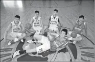  ?? PROVIDED TO CHINA DAILY ?? Five of the first batch of Chinese students to attend the United States Basketball Academy relax during a break in training at the facility in Eugene, Oregon.