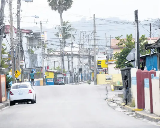  ?? RICARDO MAKYN/CHIEF PHOTO EDITOR ?? The streets of Annotto Bay, St Mary, on Thursday, looking almost like a ghost town since the quarantine was announced to stem the spread of COVID-19 in the parish.