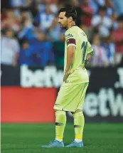  ?? AFP ?? Real Madrid’s Gareth Bale (left) and Barcelona star Lionel Messi wear dejected looks after their respective teams suffered humiliatin­g losses at the hands of Sevilla and Leganes.