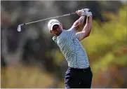  ?? KAMRAN JEBREILI/AP ?? Rory McIlroy of Northern Ireland plays a shot on the 13th fairway during third round of the Dubai Desert Classic golf tournament Saturday.