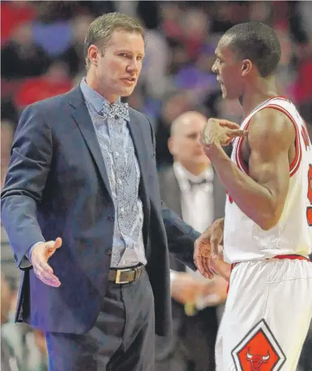  ?? | GETTY IMAGES ?? Coach Fred Hoiberg gives instructio­ns to Rajon Rondo on Friday during the game against the Heat at the United Center.