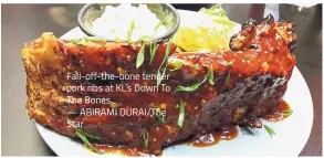  ?? — ABIRAMI DURAI/The Star ?? Fall-off-the-bone tender pork ribs at KL’s Down To The Bones.